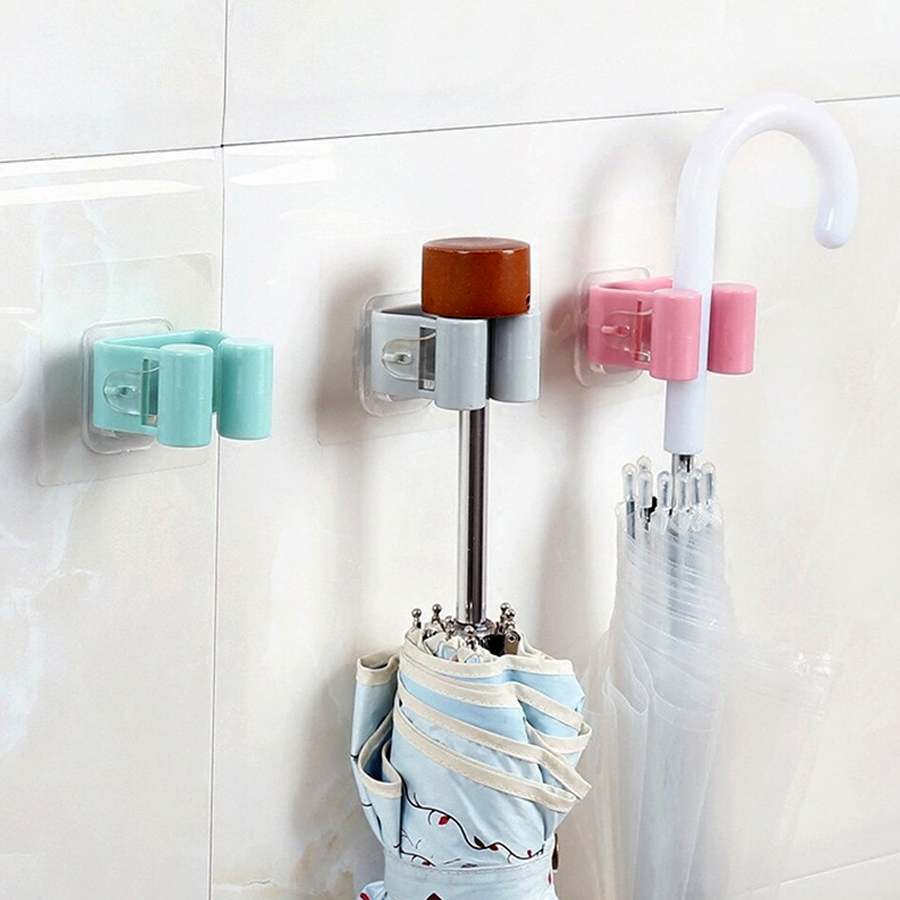 A wall - Mounted Mop & Broom Holder